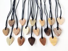 several wooden hearts hanging from black cord