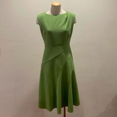 Preset Dress Can Be Worn With Boots Or Heels. Material Has A Slight Stretch. No Tears, Holes Or Stains. Never Worn. Zips Up In The Back. The Mannequin Is A Bit Skinny But If You Have Some Curves It Will Accent Your Shape Nicely. Questions?! Please Comment Below. Measurements Lying Flat- Pit To Pit: 17 Inches Waist: 14 Inches Top To Bottom Of Garment: About 40 Inches Green Fitted Sleeveless Evening Dress, Green Sleeveless Lined Midi Dress, Green A-line Sleeveless Dress For Work, Dresses Green, Maggy London Dresses, London Dresses, Maggy London, Green Dress, Dream Closet