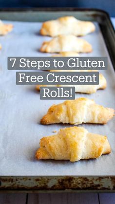 several pastries are lined up on a baking sheet and ready to be baked in the oven