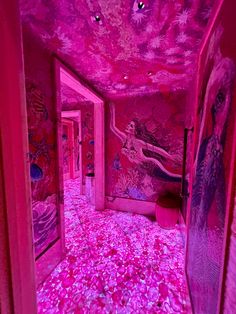 a room with pink walls and flooring that has flowers all over the floor in it