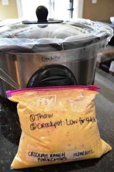 a bag of food sitting on top of a counter next to an electric pressure cooker