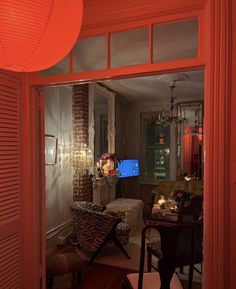 a living room filled with furniture and a flat screen tv