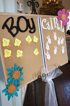 two bulletin boards are decorated with paper flowers and the words boy and girl on them