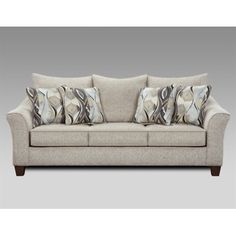 an image of a couch with pillows on the top and bottom cushions in grey color