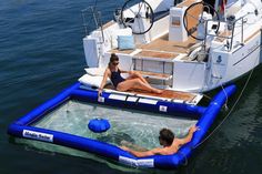 two people in an inflatable pool on a boat