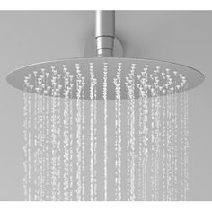 an overhead shower head with water running down it