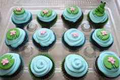 cupcakes with blue frosting and green decorations