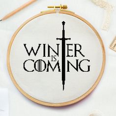 a cross - stitch pattern with the words'winter is coming'in black and white