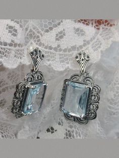 Natural Blue Topaz Earrings, Rectangle gemstones edged with fine lace filigree detail accenting the lovely natural blue topaz stone, Natural Blue Topaz earrings Elegant Blue Sterling Silver Earrings, Blue Topaz Filigree Jewelry For Anniversary, Anniversary Filigree Jewelry With Blue Topaz, Elegant Nickel-free Blue Topaz Jewelry, Victorian Filigree Jewelry With Blue Topaz, Blue Vintage Sterling Silver Earrings, Oval Blue Topaz Filigree Jewelry, Ornate Silver Blue Topaz Jewelry, Elegant Nickel-free Blue Topaz Earrings