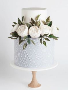 there is a white cake with flowers on it