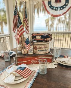 an american flag themed table setting on a porch