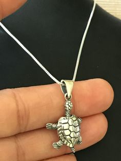 Sterling Silver Turtle Charm Pendant Necklace Cutest Turtle Charm With Moving Head and Tail. Metal: All components are made from solid .925 Sterling Silver Measurement: pendant height is 30mm (1.2 inches) Choose Chain Length You can find other charm jewelry in my shop here https://www.etsy.com/shop/LinksAndStones?ref=seller-platform-mcnav&section_id=24389019 Please feel free to Convo me with any questions before purchasing. Please view policy before purchasing Thank You For Visiting My Shop Handmade Turtle-shaped Sterling Silver Jewelry, Handmade Sterling Silver Turtle Jewelry, Nautical Necklace, Sunshine Necklace, Turtle Gifts, Turtle Charm, Turtle Necklace, Turtle Pendant, Silver Chain Style