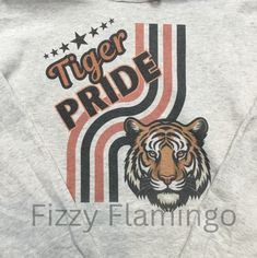 This TIGER PRIDE sweatshirt is made on a JERZEE brand oatmeal hoodie. It is made using sublimation so you will not feel the design. It is meant to have a slight vintage or faded look. This shirt is made and shipped by me (NO drop shipping) thank you for supporting my small business. Feel free to reach out if you have questions or need a different color. Pride Hoodie, Tiger Mascot, Mascot Shirt, Tiger Hoodie, Retro Sweatshirts, Drop Shipping, Tigers, Orange Black, Favorite Outfit