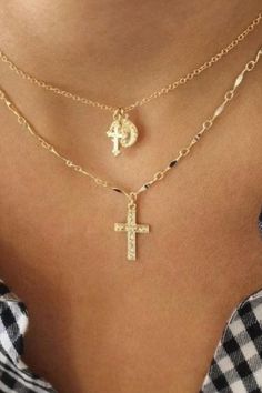 A woman wearing a gold cross necklace. Silver Plated Pendant Charm Necklace, Delicate Gold Plated Silver Charm Necklaces, Delicate Silver Gold-plated Charm Necklaces, Delicate Silver Charm Necklaces Gold Plated, Gold Plated Silver Cross Necklace, Silver Gold-plated Cross Necklace, Silver Cross Necklace Gold Plated, Silver Gold-plated Charm Necklace With Delicate Chain, Silver Delicate Chain Charm Necklace, Gold-plated