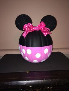 a minnie mouse pumpkin with polka dots on it