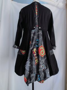 "Wearable art coat Loaded with detail. It's fashioned in an abstract 19th Century style. Features: * tailored bodice with flounced skirt * embroidery and patchwork throughout * metal crest buttons down the sleeves, down the front and on the waist in the back * drawstring neck, hem and pockets * metal gromets on the pockets Made by ANIMALE, Size Small. Measurements, laying flat: 15\" across shoulders 18\" underarm to underarm 17\" across waist 27.5\" across bottom hem 34\" length in front, 40\" l Artistic Black Long Sleeve Outerwear, Artistic Black Outerwear For Fall, Black Bohemian Patchwork Outerwear, Bohemian Black Outerwear With Patchwork, Bohemian Black Patchwork Outerwear, Black Bohemian Cotton Outerwear, Artistic Fitted Long Sleeve Outerwear, Sewing Upcycle, Art Coat