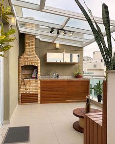 an outdoor kitchen with a brick oven and grill