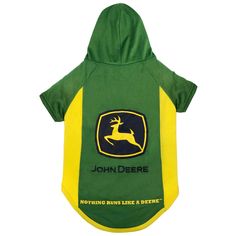 a dog wearing a green and yellow jacket with a deer on it's back