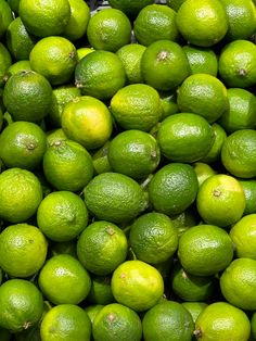 a pile of limes sitting next to each other