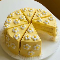 a white cake with yellow and white frosting