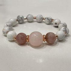 Stylish bracelet made out of white howlite, rose quartz and rose jade. 🌸⠀ ⠀ White Howlite is a calming stone, brings compassion and sensitivity to its wearer.⠀ ⠀ - soothes the body, mind, spirit ⠀ - helps balance calcium levels in the body⠀ - great for people who overreact or too emotional ⠀ - connects to the third-eye chakra⠀ All jewelry comes in premium packaging, gift ready, plus a stylish postcard All of our jewelry are designed and crafted by hand in our atelier in Bulgaria with careful at Elegant White Rose Quartz Crystal Bracelet, White Rose Quartz Beaded Bracelets As Gift, White Rose Quartz Beaded Bracelet As Gift, White Rose Quartz Crystal Bracelet As A Gift, White Crystal Bracelet With Gemstone Beads, Pink Beaded Bracelets For Meditation, Adjustable White Rose Quartz Jewelry, Healing Rose Quartz Beaded Bracelets In Rose Gold, White Crystal Bracelet For Healing