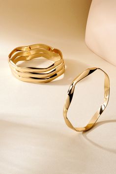 Material: Brass Plating: Choose from 14K Gold or Rhodium, each finished with an eco-friendly clear coating (ecoat) to protect against wear and tarnishing. Measurement: This bangle is 0.25 inches wide. Modern Bangle, Modern Gold Jewelry, Wavy Design, Gold Jewelry Sets, Gold Bangles Design, Bangle Designs, Bangle Set, Bangles Jewelry, Elevate Your Style