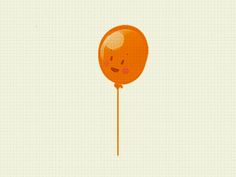 an orange balloon with a smiley face on it