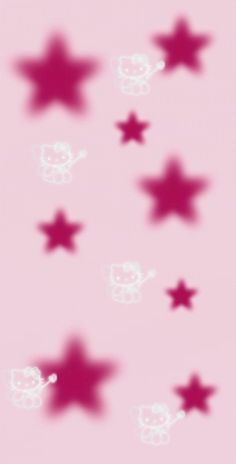 an image of some stars in the air on a pink background that is blurry