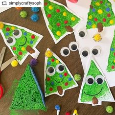 paper plate christmas trees with googly eyes and pom - poms on them