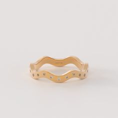 Elevate your style with the Diamond Wavy Ring, a beautiful piece crafted from 14k solid gold. Its unique zigzag design adds a touch of sophistication to your look, making it a perfect choice for stacking with other rings or wearing as a standalone statement piece. The ring can be made with yellow, rose, or white gold, please choose your size from the dropdown menu options above. 𝐑𝐢𝐧𝐠 𝐃𝐞𝐭𝐚𝐢𝐥𝐬 ❥ Solid gold, available in 10, 14 & 18 karats. ❥ Gold Color Options: White Gold, Yellow Gold, Rose Gold ❥ Band Options; Yellow Gold, White Gold Rose Gold ❥ Band Width: 2.50 mm ❥ Top Width: 3.70 mm ❥ Thickness: 1.50 mm ❥ Gemstone: Genuine White Diamond ❥ Gem Color and Clarity: G Colour SI Clarity ❥ Total CTW: 0.33 ctw 𝐂𝐮𝐬𝐭𝐨𝐦𝐢𝐳𝐚𝐭𝐢𝐨𝐧: We would be delighted to accommodate any custom Minimalist Yellow Gold Wavy Ring, Everyday Stackable 14k Gold-filled Yellow Gold Rings, Gold 14k Gold-filled Stackable Rings, Simple 14k Gold-filled Yellow Stackable Rings, Flush Set Diamond, Zigzag Design, Rose Gold Band, Stackable Rings, Everyday Jewelry