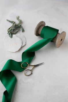 Emerald green satin ribbon  Double-faced 100% polyester Made in India Wood spool is sold separately. If your desired width/length is out of stock, please inquire.  Choose from four widths: * 1½" wide * 2¼" wide (pictured) * 3" wide * 4" wide Full spool: 50 yards  If out of stock, contact for availability. Hand-wound into a roll. If ordering multiple quantities, the ribbon may arrive as consecutive yardage. Bulk quantities may arrive on a cardboard or plastic spool.  🟨 NOTE: If your project is c Satin Sashes With Ribbon For Gift, Wood Spool, Hand Wound, Green Ribbon, Green Satin, Double Face, Satin Ribbon, Emerald Green, Emerald