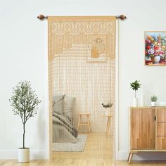 a living room scene with focus on the screen door and wooden furniture in the background