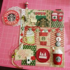 the contents of a starbucks coffee bag laid out on a pink tablecloth with red and green accents