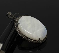 White Moonstone Gemstone Pave Diamond Oxidized Sterling Silver Exclusive Pendant at Wholesale Price. ** HANDMADE PENDANT** SIZE : 47mm x 28.15mm x 10mm ( including Bail)( LxWxH) GROSS WEIGHT : 15.95g STONE WEIGHT : 9.56g DIAMOND WEIGHT : 0.53 Cts GEMSTONE GRADE : AAA+ GRADE GEMSTONE : NATURAL SMOOTH RAINBOW MOONSTONE TREATMENT : NO TREATMENT METAL : OXIDIZED 925 STERLING SILVER SHAPE : OVAL DIAMOND : GENUINE DIAMONDS SETTING : PAVE SETTING **All Measurements are close approximations** RAINBOW MO San Ramon, Pendant Diamond, White Moonstone, Moonstone Bracelet, Pretty Bracelets, Sapphire Necklace, Moonstone Pendant, Bezel Diamond, Oxidized Sterling Silver