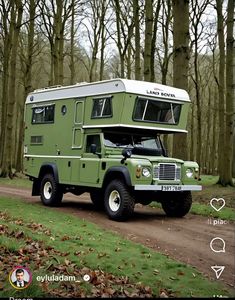 a green truck with a camper on the back