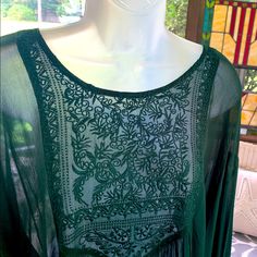 World Market Flowy Dark Green Sheer Embroidered Top. Obviously Needs A Cami Under Orbe Daring? It Fits A L-Xl Depending Upon Fit Preference. Measures 26 1/2” Across Armholes And 28” Length. Full Sleeves Are Trimmed And Tied With Tassel Rope. Never Worn. It Is A Beauty! Green Intricately Embroidered Festive Top, Green Bohemian Tops With Intricate Embroidery, Green Bohemian Flowy Peasant Top, Green Bohemian Peasant Top, Flowy Fit, Sheer Embroidered Top, Bohemian Semi-stitched Green Embroidered Fabric, Ruffle Hem Blouse, Bell Sleeve Shirt, Studded Shorts