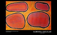 an orange and red painting with four oval shapes