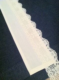 the white lace is being sewn together