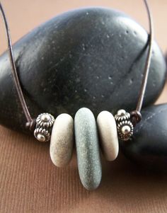 Use Michigan rocks...love his idea! Need a dremel. Michigan Rocks, Memory Necklace, Beach Stones Jewelry, Pebble Jewelry, Trio Necklace, Beach Pebbles, Eco Warrior, River Rocks, Rock Jewelry