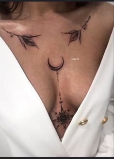 a woman's chest with arrows and stars on it