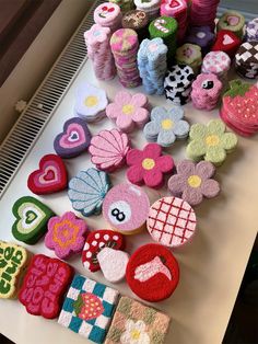 many decorated cookies are sitting on a table