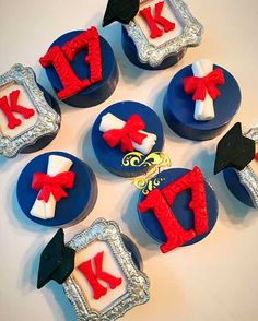 cupcakes decorated with red, white and blue icing are arranged in the shape of letters