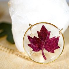 Our preserved Maple leaf necklace is the PERFECT way to embrace the fall season.This necklace is made with tiny leaves, cut from larger maple leaves. They are preserved in clear  bio-resin and set in a 30 mm silver or gold-plated frame. This fall beauty will come to you on either a 24k gold-fill chain or a sterling silver chain, you choose the length!Please keep in mind that each necklace will be a bit different! Each leaf may vary slightly in color or shape, due to the nature of "nature" and th Handmade Jewelry For Fall Gift, Red Nature-inspired Jewelry For Gifts, Brown Leaf-shaped Jewelry For Gift, Red Pressed Flowers Round Jewelry, Red Round Jewelry With Pressed Flowers, Handmade Burgundy Necklace As Gift, Handmade Burgundy Necklace For Gift, Brown Jewelry Gift For Fall, Brown Jewelry For Fall Season Gift