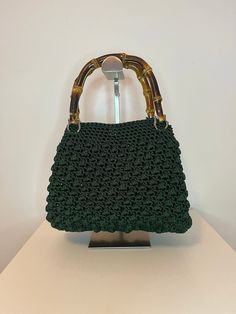 Hand crocheted bag in Swam Black 100% polyester cord. Leather base, bamboo handles and magnetic button closure. Width 27 cm Height 25 cm Petrol green color (various colors available). The bag is made to order and requires at least a week of preparation. Customizations can be requested both in terms of the material used and the dimensions. Due to the handmade nature of this item, dimensions may vary slightly. For further information contact me, I will be happy to answer you. Sunflower Granny Square Pattern, Sunflower Granny Square, Pattern Home Decor, Delicate Clothes, Handmade Crochet Bags, Bamboo Handles, Lace Patterns, Hand Crochet, Vintage Charms