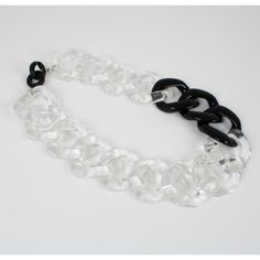 This is part of Chairish’s Costume Jewelry assortment.  This elegant Angela Caputi, made in Italy choker necklace features an extra-large flat resin chain design in trans[arent color with black contrast. Her matching of colors is always bold and classy. As you know, Caputi jewelry is not signed. This pre-owned necklace has had the plastic tag removed, but it still has the original brand signature tow-hooks closing clasp. Angela Caputi produced resin and Lucite jewelry collections since the 1980s Modern Black Chain Necklace For Party, Chic Black Chain Link Necklace, Trendy Black Chain Link Necklace, Trendy Black Chunky Chain Necklace, Trendy Black Glass Jewelry, Black Glass Chain Jewelry, Black Chain Link Necklace For Party, Chic Black Chunky Chain Necklace, Black Chunky Chain Choker Necklace