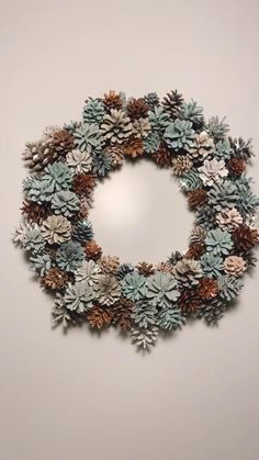 a christmas wreath made out of pine cones