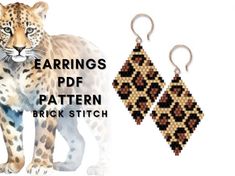 a pair of earrings with an image of a leopard