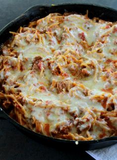 a casserole dish with meat and cheese in it