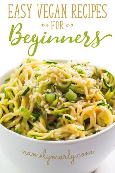 a white bowl filled with noodles and vegetables