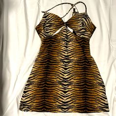 **Brand New** Never Worn Tie Up Back Cheetah Dress. Fitted Leopard Print Mini Dress For Vacation, Chic Tiger Print Mini Dress For Spring, Spring Tiger Print Dress For Night Out, Spring Party Mini Dress With Tiger Print, Fitted Tiger Print Mini Dress For Summer, Summer Mini Dress With Tiger Print, Summer Tiger Print Dress For Date Night, Summer Tiger Print Mini Dress, Sleeveless Tiger Print Mini Dress For Summer